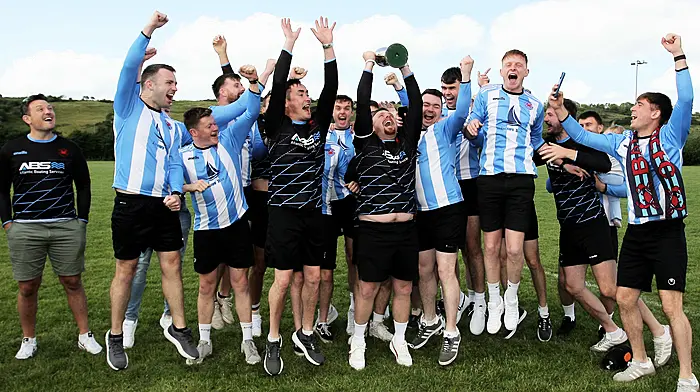 The Baltimore FC team celebrates with the O'Brien Water Srvices.com Championship Cup.