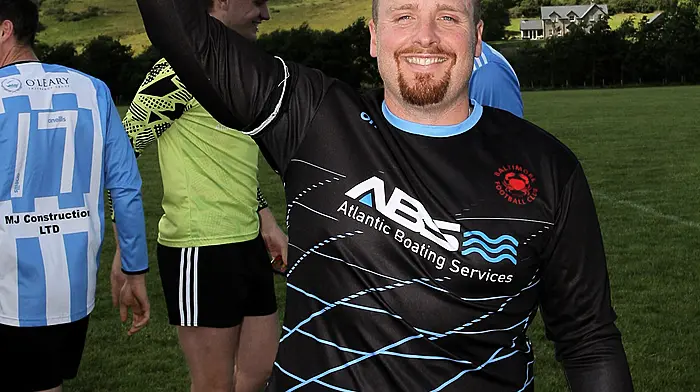 Kieran Lynch captain of the Baltimore FC team raises the O'Brien Water Services.com Championship Cup. (Photo: Paddy Feen)