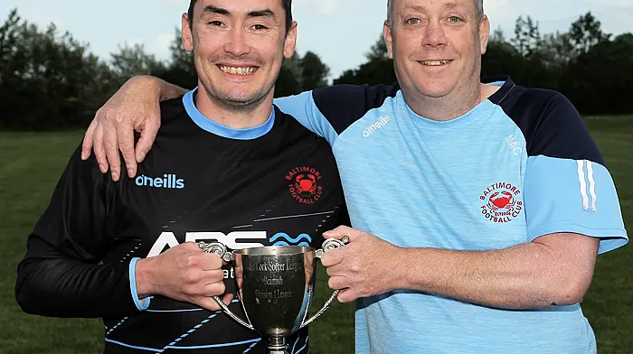 Denis and Sean McCarthy with the cup. (Photo: Paddy Feen)