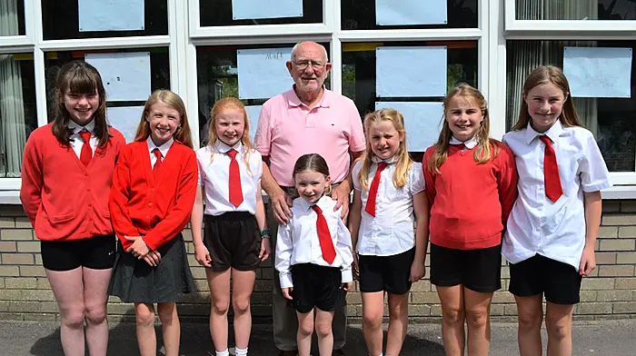 Tadhg Murphy from Rosscarbery with seven of his granddaughters who are currently pupils at St Mary's National School in Rosscarbery, Amy Murphy, Clodagh Duggan, Eabha Duggan, Siún Duggan, Orla Murphy, Aisling Murphy and Meabh Murphy. (Photo: Anne Minihane)