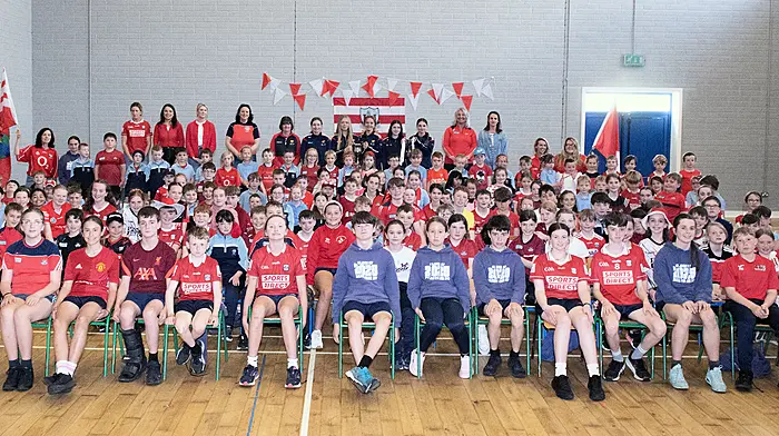 Teaching staff and pupils of Baryroe National School welcomed the Ibane members of the Cork LGFA team that won the All-Ireland U14 platinum final that included Kate Collins, Niamh Doyle, Aoife Harte, Aoife Walsh, Aibhlin McCarthy and their coach Mary Harrington.  (Photo: Martin Walsh)