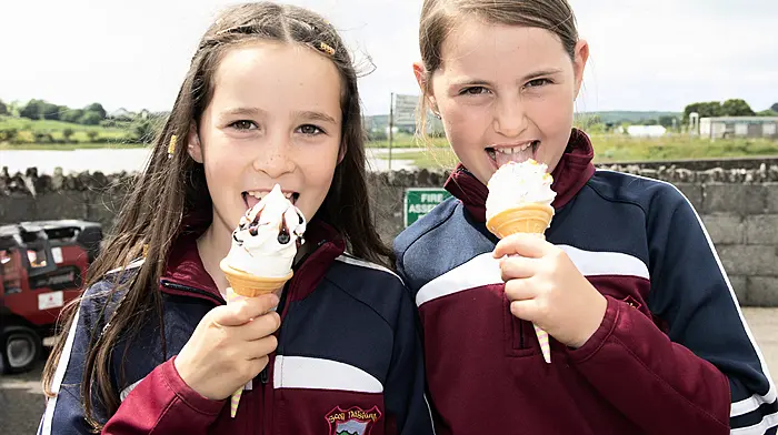 Catherine Foley and Ruby Hurley enjoying some ice cream at Timoleague National School’s celebration day.  (Photo: Martin Walsh)