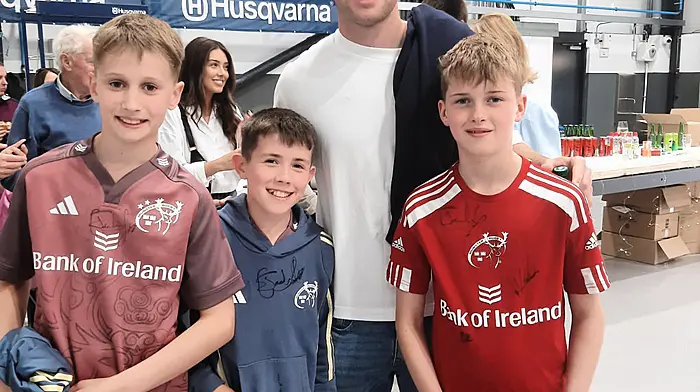 Darragh O'Connor, James Buckley and Evan O'Driscoll from Muskerry RFC with Munster and Ireland rugby star Jack Crowley at the opening of the new Atkins showroom in Bandon on Saturday June 14th.