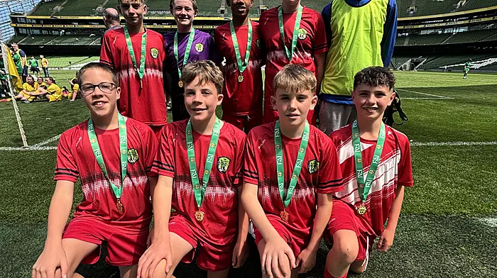 Rath National School’s sixth class boys did the community proud by reaching the FAI soccer final at the Aviva where they finished in third place in their group. Back: Ben Pitton Brady, Tadhg Ronan, Kingsley Crosby, Senan Whooley and Shane Hallihane (coach). Front: Jesse Best, Theo Best, Fionn Daly and Paddy Sheehy (captain).