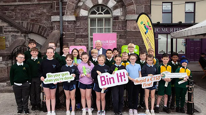 Pupils from St Joseph's Primary School and St Colman's Boys National School in Macroom with deputy county mayor Cllr Martin Coughlan, the Gum Litter Taskforce (GLT), Cork County Council and Macroom Tidy Towns, who all took to the streets of Macroom this week to demonstrate the proper means of gum disposal and raise awareness of the environmental and fiscal impacts of gum litter.   (Photo: Diane Cusack)