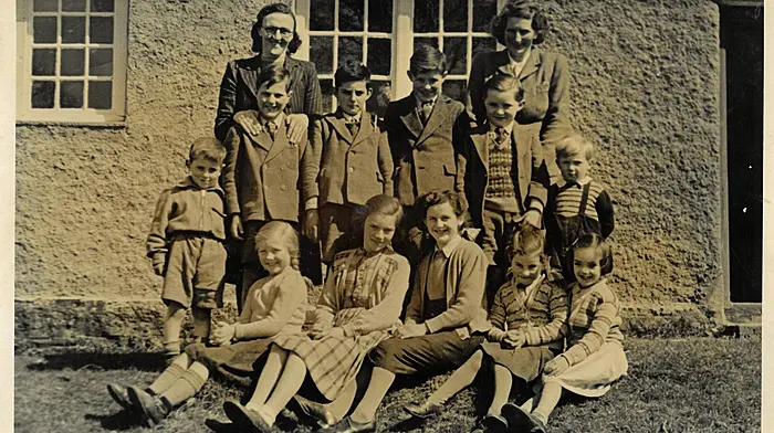 Curravarahane National School. Back row (from left): Mrs Hawkes (teacher), and Mrs Good. Middle row (from left): Herbie Jennings, Ray Good, Robin Jennings, John Jennings, Fergus Appelbe, and Frank Good. Front row (from left): Iris Good, Kay Loane, Marion Jennings, Betty Jennings and Harriette Loane.  c1950.