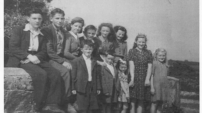Sitting on Maggie Kelleher's Bridge in Ballinascarthy are Andy Kelleher, Pat O'Donovan, Joan Kelleher, Jackie Kelleher, Judy McCarthy, Kitty McCarthy.
Standing (from left): Johnny Nyhan, Tommy Nyhan, Mary Kelleher, two other children unknown.