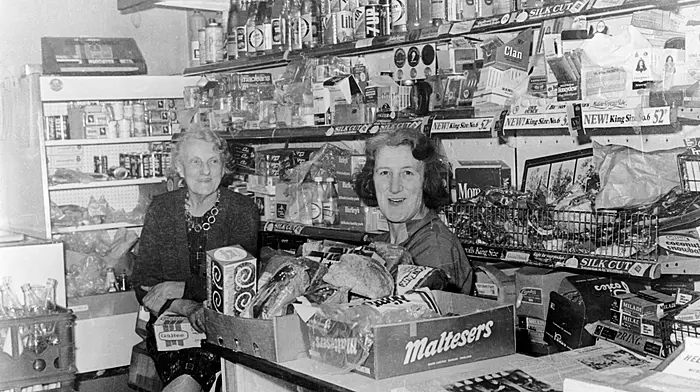 May Berry and Kathleen Crowley catching up on the events of the day in Kathleen's shop 'The Favourite' on Bridge Street, Skibbereen in 1979. (Photo: Michael Minihane)