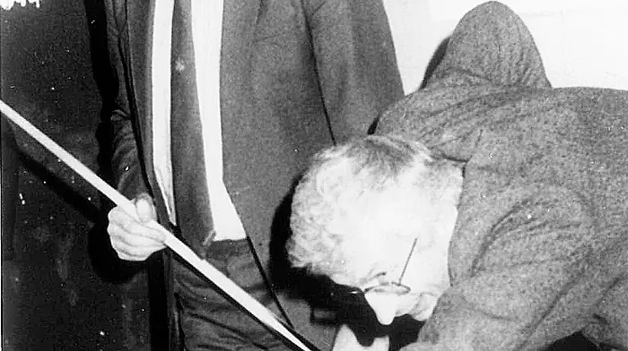 49.	Jim O’Keeffe T.D. ‘snookered’ by Joe Walsh Minister for Food at the opening of Paddy Boyles Bandon team snooker competition. (November 1988)