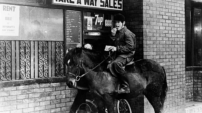 No nosebag for the pony on this occasion, but its rider enjoyed a tasty bag of chips courtesy of The Busy Bee on Ilen Street, Skibbereen in 1980. (Photo: Michael Minihane)