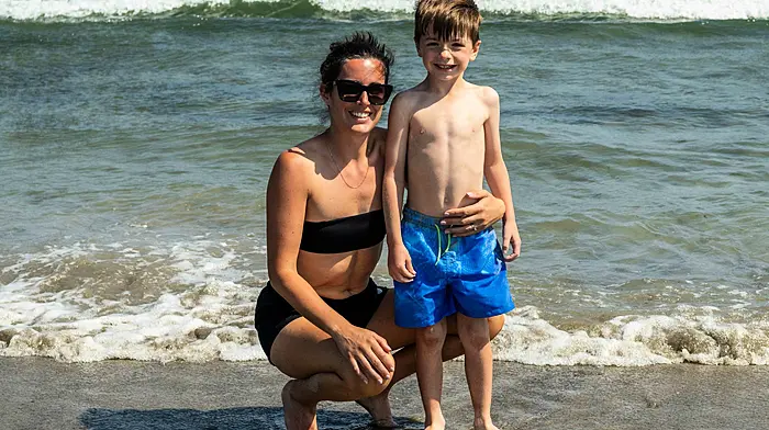 Rosscarbery, West Cork, Ireland. 19th Jun, 2025. Sunshine and 26C temperatures brought people to the Warren Beach in Rosscarbery today. Cooling off in the sea were Elaine and Noah Shanahan from Rosscarbery. Picture: Andy Gibson.