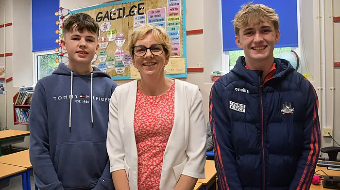 Left: Elaine and Noah Shanahan from Rosscarbery. Above: Anne McCarthy, Principal Ardagh Boys NS with former pupils John Harte and Tom Browne. Photos: Andy Gibson & Anne Minihane)