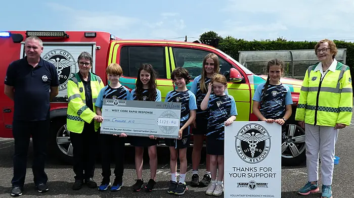 Student council members from Canovee National School handing over the proceeds of their very successful bake sale to West Cork Rapid Response; Liam Slattery (WCRR), Kate Crowley (WCRR), Éanna McCarthy, Aoife O'Driscoll, Caoimhe Nash, Anna O'Sullivan, Méabh Harrington, Máire O'Donovan and Betty Hennessy (WCRR).