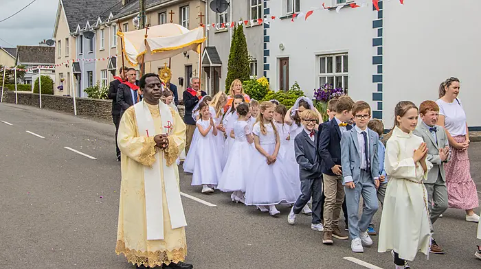 Fr Emmanuel assisting Fr Pontianus Jafla in Kilbrittain as the Corpus Christi procession headed through the streets of Kilbrittain to the grotto at the end of the village where the church choir performed for those in attendance.