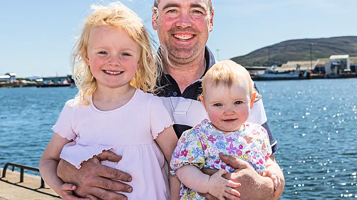 Diarmud Dudley with his two beautiful daughters Isla and Rose enjoying the sunshine in Castletownbere.  (Photo: Anne Marie Cronin)