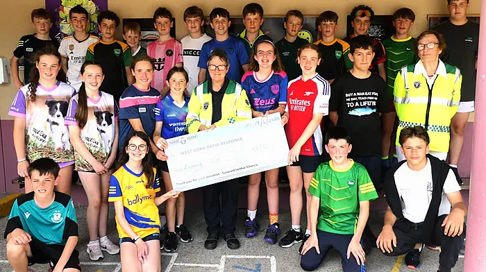 A very colourful sixth class from Kilmurry National School handing over their donation to Kate Crowley and Betty Hennessy of West Cork Rapid Response, the proceeds from their very successful jumble sale which everyone really enjoyed.