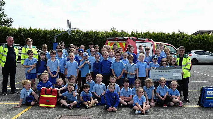 The pupils from Scoil Lachtaín Naofa in Cillnamartra who held a no uniform day and a bake sale to raise funds for the West Cork Rapid Response. They presented the proceeds to Liam Slattery, Betty Hennessy and Kate Crowley of WCRR during their recent visit.