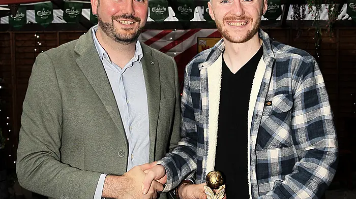 Senator Noel O'Donovan presents the Players' Player of the Year to Chris Collins.