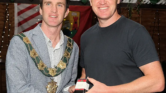 Mayor of Clonakilty Conan O'Donovan presents medals to the Clonakilty Soccer Club goalkeeper Iain O'Driscoll.