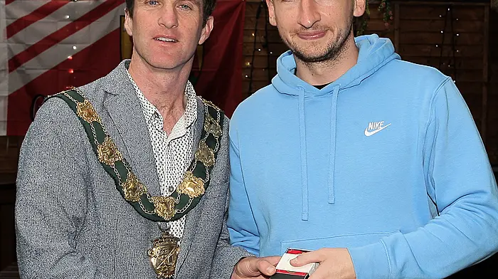 Eoin Hartnett receives his medals from the Mayor of Clonakilty Conan O'Donovan.