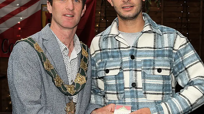 Ethan Draper receives his medals from the Mayor of Clonakilty Conan O'Donovan.