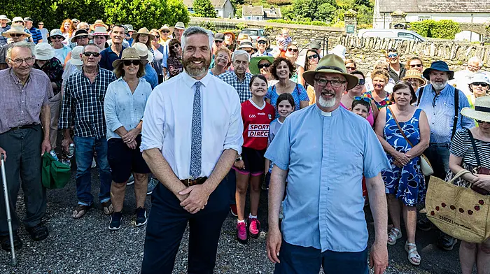 Minister Christopher O’Sullivan with Dean Cliff Jeffers and a large crowd at the annual Rosscarbery Union of Parishes garden fete which was held last  Saturday.