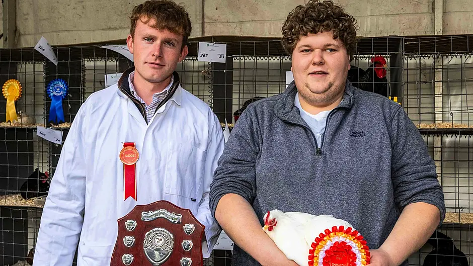 Kieran O'Sullivan, Skibbereen, with his White Pecan, being presented with his  'Best True Bantam' rosette by judge Darren Keohane at the agricultural show at Dunmanway.