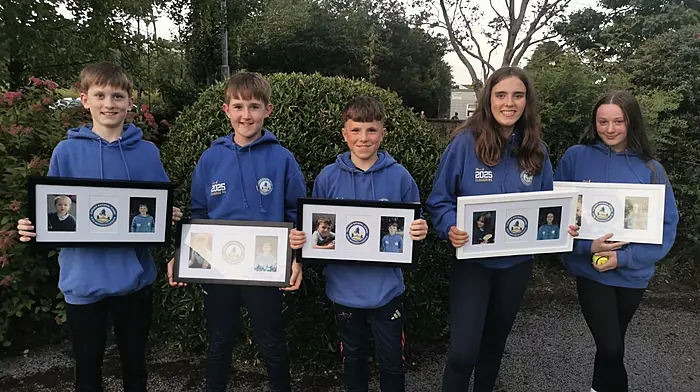 At their graduation mass with their photo frames and sliotars presented to them from the Clogagh National School’s parents association are Conor Cashman, Ryan Deasy, Harry O'Reilly, Ayla Bishop and Neasa Kiernan. Thanks was expressed to Fr John for a lovely mass and the national school leavers are wished all the best in their next chapter.