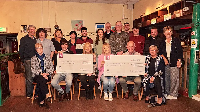 The Ballygurteen Harvest Festival committee recently presented cheques to Breast Cancer Ireland and Clonakilty Community Hospital. Back: Dermot Keohane, Denis Healy, Lauren Murphy, Mary McCarthy, PJ O’Driscoll, Kathlyn McCarthy, Vincent Dullea, Kevin O’Regan, Darragh Collin’s, Brian Murphy, Aidan O’Donovan and Mary McSweeney. Front: Hannah Keohane, Cathal McCarthy, Kay Keohane, Ann Healy, Bobby Patterson and Mairead O’Brien. Photo courtesy of Noel Murray.