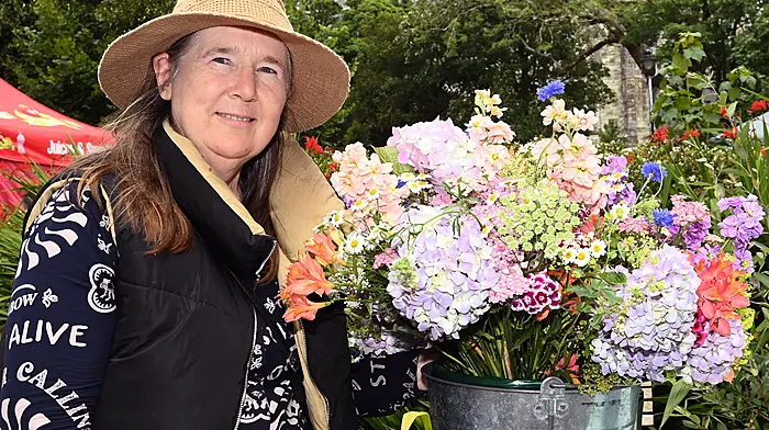Joanna Wood with her flowers at the Friday market.  (Photo: Martin Walsh)