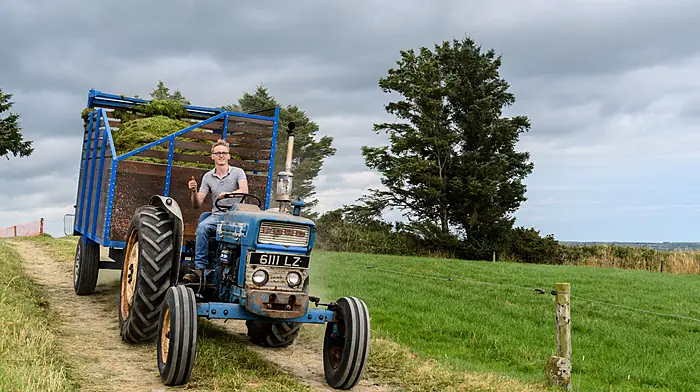 Simon Jennings (Enniskeane) heading to the pit with a Ford tractor and trailer at the vintage harvest day in The Pike which was hosted by the West Cork Vintage Ploughing & Threshing Association.  (Photo: David Patterson)