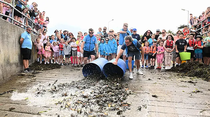 Making a splash as the crabs return to the sea at the end of children's crab fishing competition during the Courtmacsherry Harbour Festival.  (Photo: Martin Walsh)