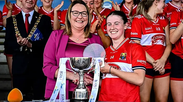 Trina Murray (president, LGFA) presenting Kate Carey with Player of the Match award after Kate and the minors were crowned All-Ireland A minor champions following their win over Dublin last Saturday in the final. Lord mayor of Cork Cllr Fergal Dennehy was also present.
