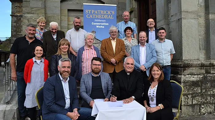Signing the contract for the start of the restoration works at  St Patrick's Cathedral in Skibbereen were 
Christopher O'Sullivan TD Minister for State at the Department of Housing, Local Government and Heritage, James Byrne of Southgate Associates, Fr Kevin O'Regan, Cllr Caroline Cronin, Deputising for Cork County Mayor. Also attending were Michael Collins TD, county councillors Isabel Towse, Brendan McCarthy, Daniel Sexton, and committee chairman Michael Dwyer, committee secretary Helen Dempsey, Joe Downing of Downing Construction Ltd, Triona Arundel of Southgate Associates, sacristian Bernie Kelly, Eileen O'Sullivan, Gerald O'Brien, June Kelly and Denis O'Driscoll. Photo: Anne Minihane..