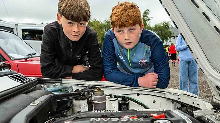 Admiring a Nissan engine in a BMW car were Matthew O'Mahony and Alex McCarthy, both Bandon. (Photo: Andy Gibson)