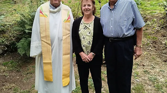 Fr Finbarr Crowley with Jim and Cheryl Calvey at the famine graveyard mass at Kilpadder.