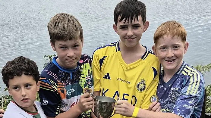 The winning crew of Tadgh O'Connor, Kevin Hickey, Mathew O'Mahony and Quinten Horstmanshoff seen after their victory in the raft race at the Ahakista Festival.