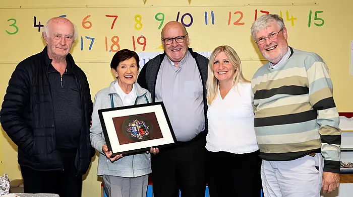 Fr Terry O'Brien MSC (centre) receiving a presentation from Peg Collins, Church Cross, to mark the end of his term as Co-PP Aughadown. Included also are Fr Donal Cahill, Mary Lou Leahy and Fr Bernard Cotter.