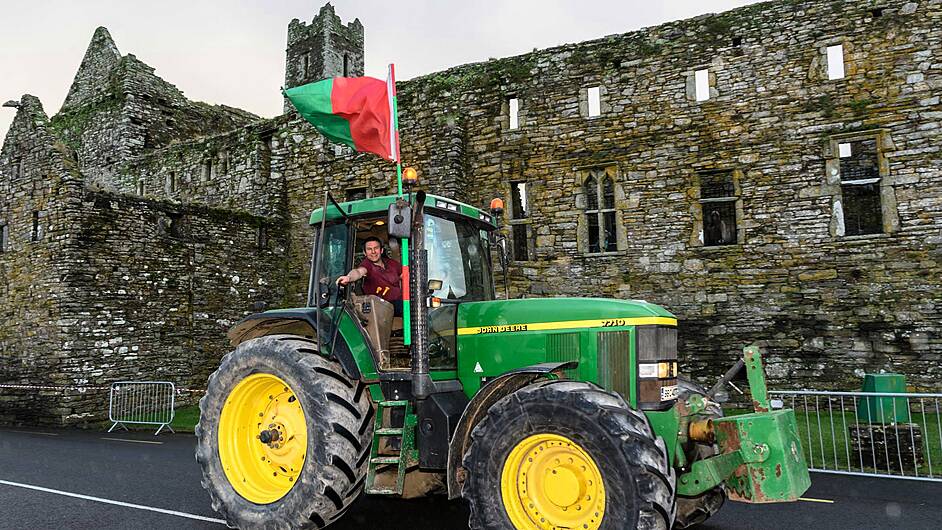 Niall Twomey from Minane Bridge drove a John Deere 7710, seen here at the Kilbrittain Tractor Run passing through Timoleague at the abbey. The proceeds of the run will go towards a state-of-the-art residential centre for autistic adults on the outskirts of Dunmanway.	(Photo: David Patterson)