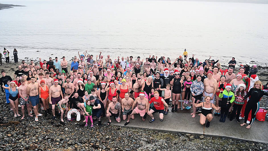 All ready for the  forty-ninth annual Christmas Day swim at Broadstrand, Courtmacsherry.  Proceeds from the fundraising swim were divided equally between COPE in Clonakilty and the Paediatric Cystic Fibrosis Unit at the Cork University Hospital.  Donations can still be made on line at gofundme.com (search Broadstrand Swim).  (Photo: Martin Walsh)