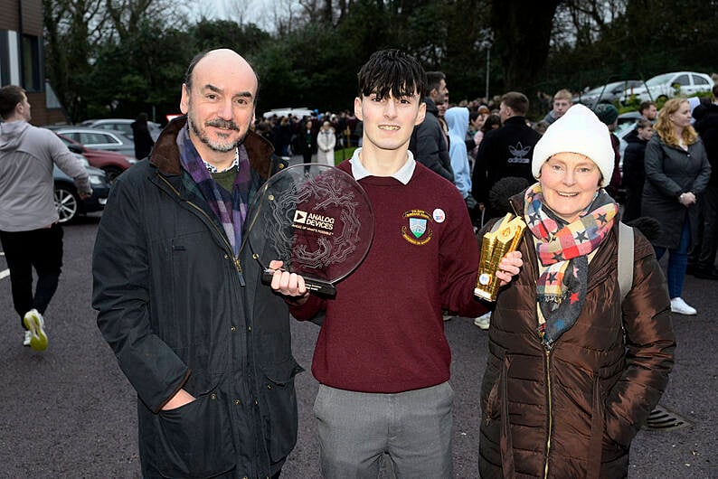 Tomás Markey back at St Brogan's College in Bandon with parents Colin and Siobhan with his award for best individual  at the BT Young Scientist of the Year. (Photo: Denis Boyle)