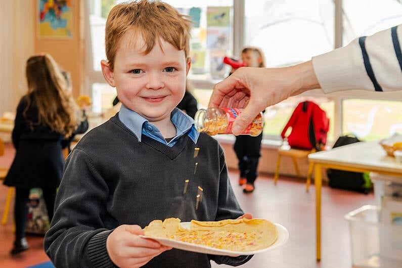 Seán óg Hayes was enjoying his pancakes on Tuesday at Enniskeane National School. (Photo: Andy Gibson)