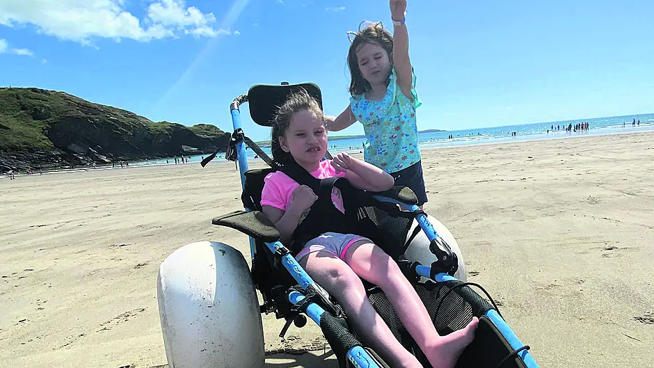 Dad says Warren Beach wheelchair made his daughter Lilly’s holiday Image