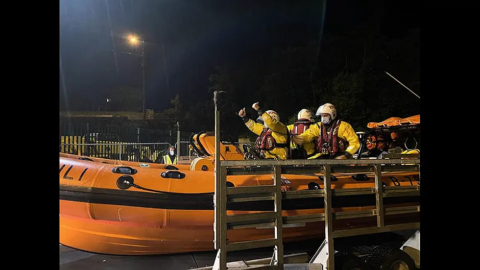 Fishing vessel with engine trouble towed to safety Image