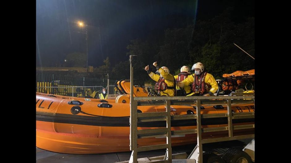 Fishing vessel with engine trouble towed to safety Image