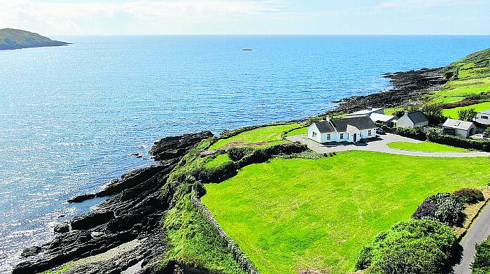 Coastal bungalow has pebble beach and secret garden Image