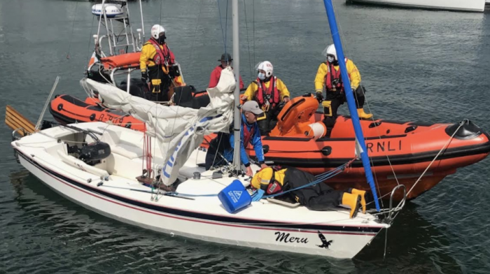 Kinsale RNLI lifeboat crew rescue two from sinking sail boat Image