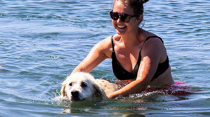 With temperatures rising in West Cork last week, Kate Walsh and dog Mia cooled off in the sea at Raheen. (Photo: Andrew Harris)