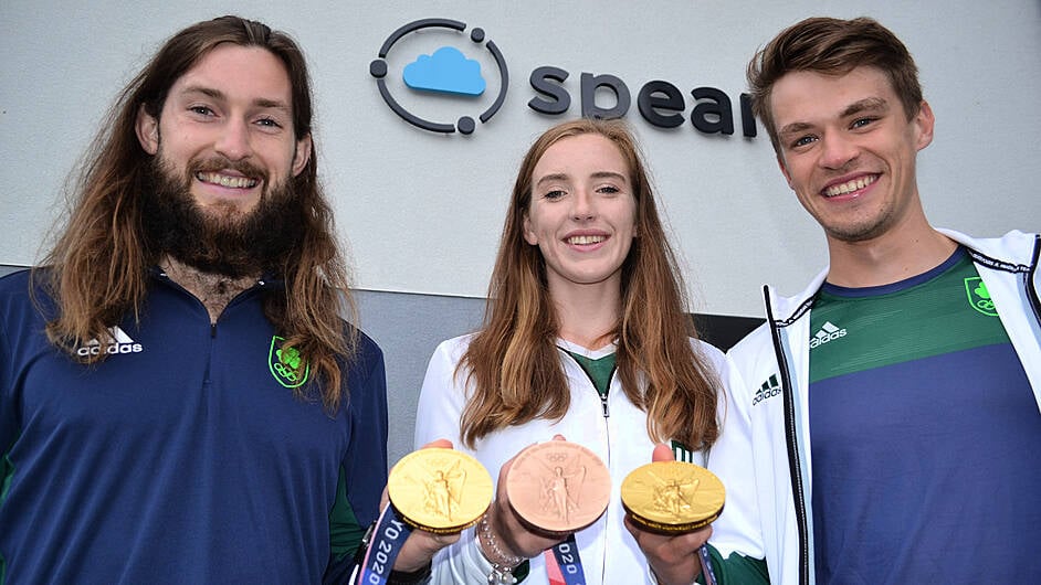 Paul O’Donovan, Emily Hegarty and Fintan McCarthy with their Olympic medals in Skibbereen on Monday evening. (Photo: Anne Minihane)