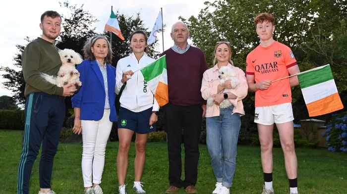 Phil Healy at her home with her family on Saturday evening; from left, her brother Diarmuid, mum Phil, dad Jerry, sister Joan, brother Padraig and dogs Lily and Fred.